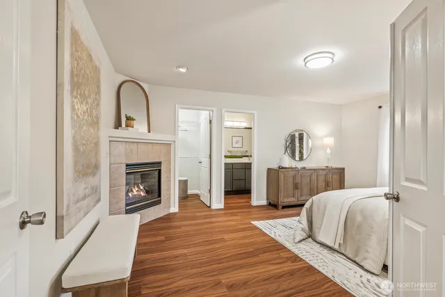 a bedroom with a bed and a fireplace