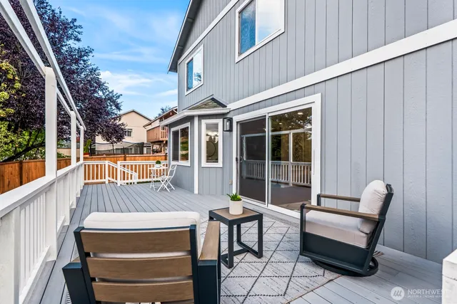 a view of a patio with a table and chairs
