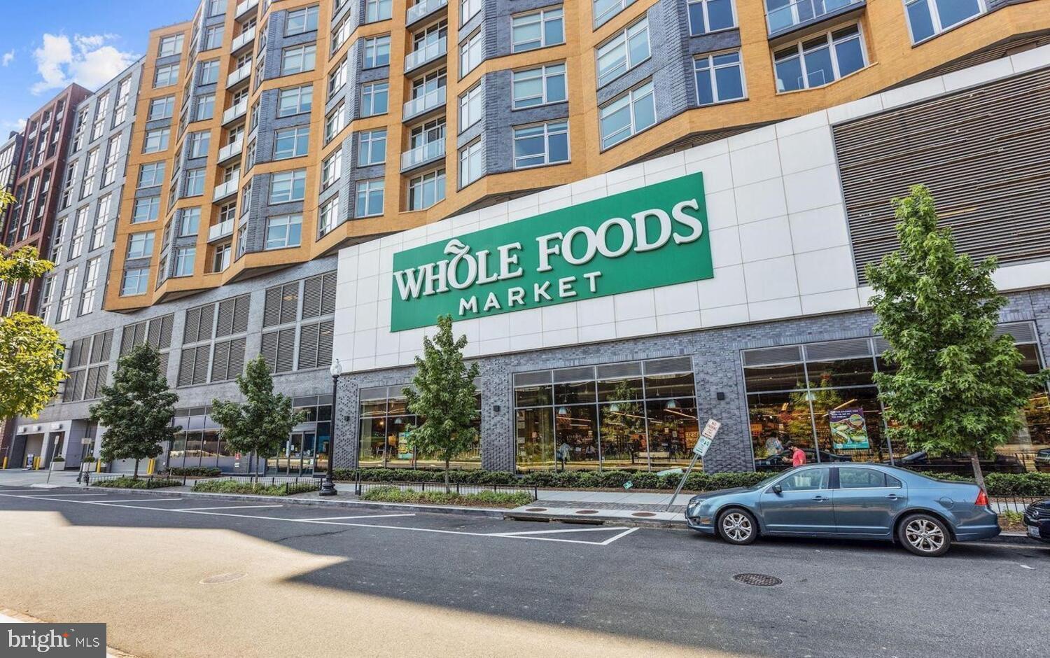 240 M Street Southwest, Unit E406 Washington, DC 20024 - Photo 29 of 38 a car parked in front of a building