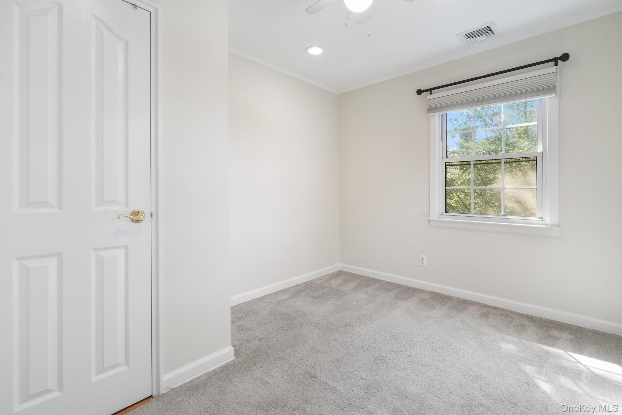 29 Chatfield Road Bronxville, NY 10708 - Photo 15 of 27 Unfurnished room featuring light colored carpet, crown molding, ceiling fan, and recessed lighting