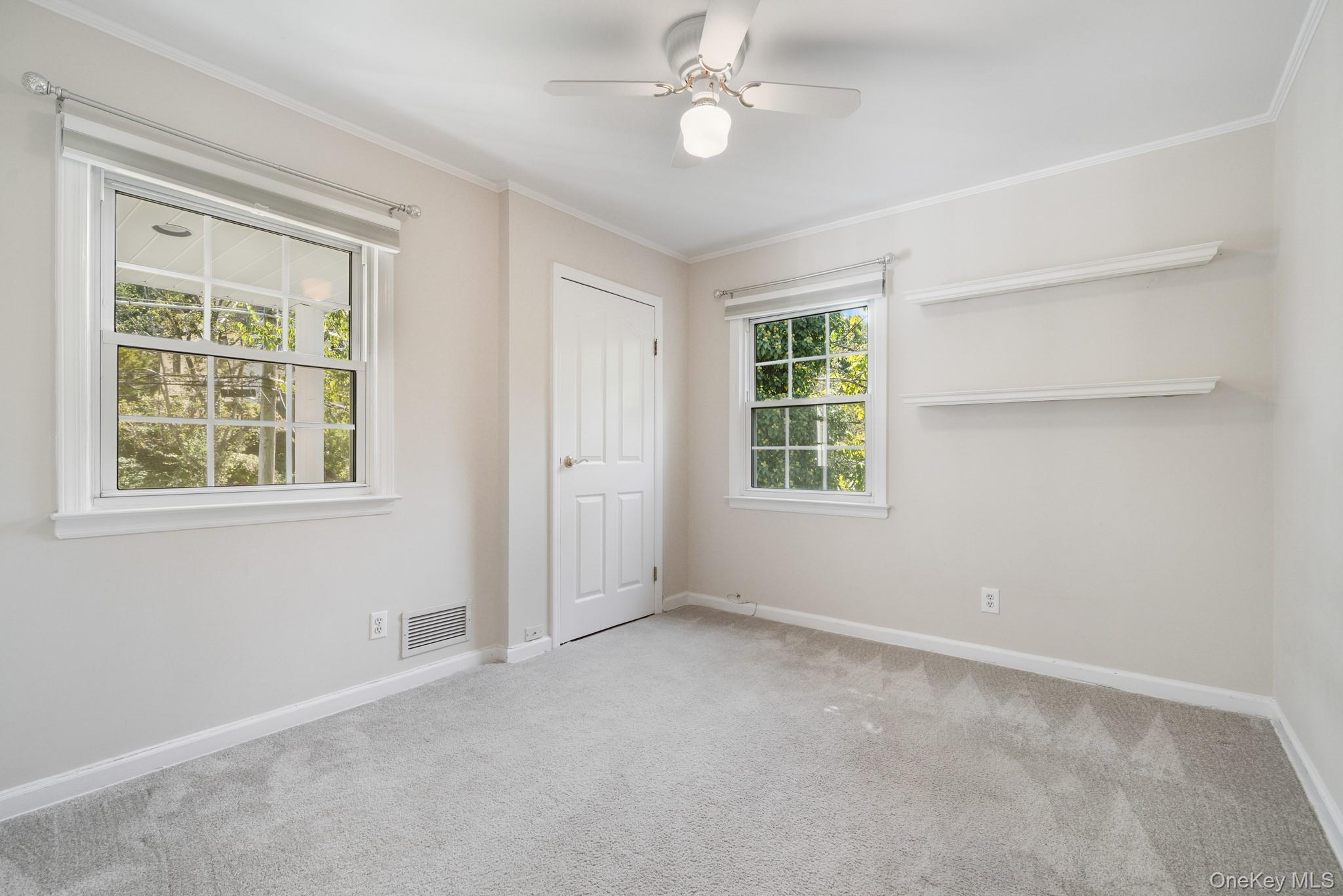 29 Chatfield Road Bronxville, NY 10708 - Photo 17 of 27 Unfurnished bedroom featuring ornamental molding, carpet floors, and a ceiling fan