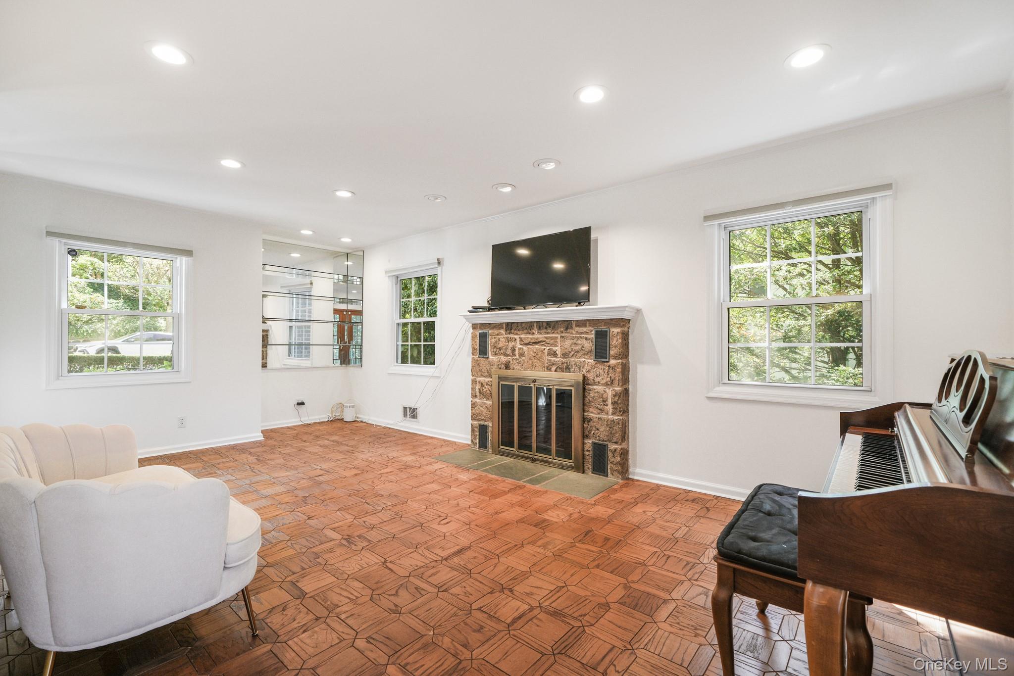 29 Chatfield Road Bronxville, NY 10708 - Photo 5 of 27 Living room featuring plenty of natural light, a fireplace, and recessed lighting