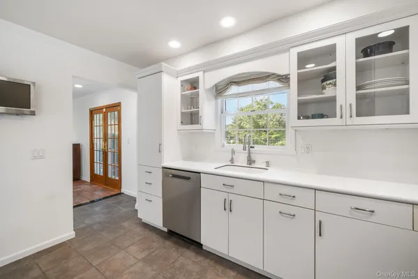 a kitchen with a sink and cabinets