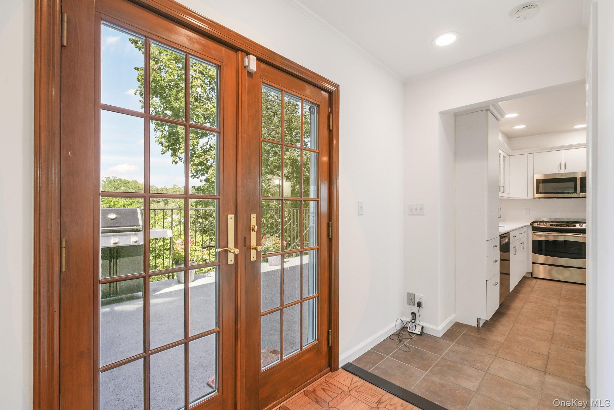 29 Chatfield Road Bronxville, NY 10708 - Photo 9 of 27 Entryway featuring french doors, tile patterned flooring, and recessed lighting