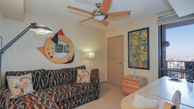 a bedroom with furniture and a window