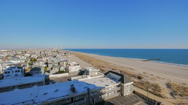 an aerial view of beach and ocean