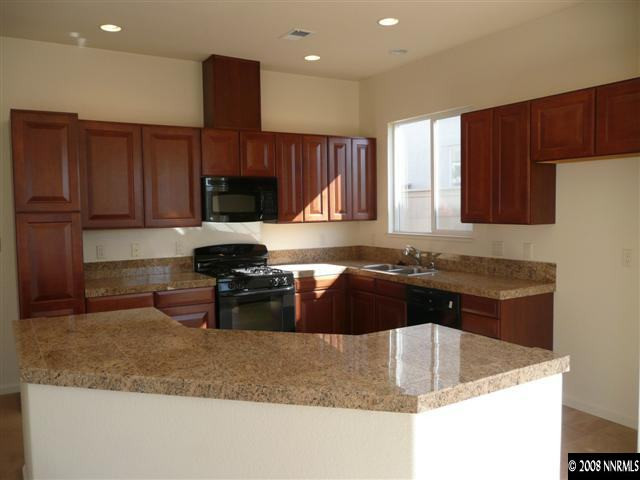 10753 Misty Meadows Drive, Unit 59 Reno, NV 89521 - Photo 2 of 9 a kitchen with a sink cabinets and window