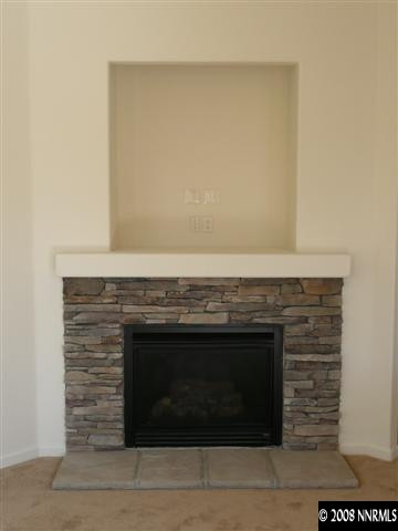 10753 Misty Meadows Drive, Unit 59 Reno, NV 89521 - Photo 5 of 9 a stove top oven sitting inside of a kitchen
