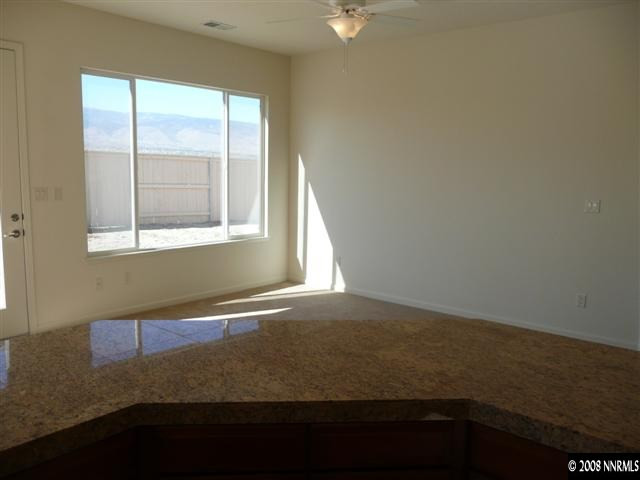 10753 Misty Meadows Drive, Unit 59 Reno, NV 89521 - Photo 6 of 9 an empty room with a window