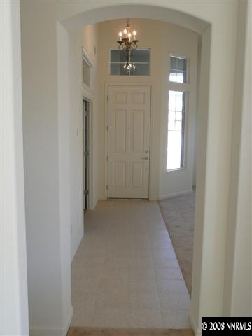 10753 Misty Meadows Drive, Unit 59 Reno, NV 89521 - Photo 7 of 9 a view of an empty room with window and cabinet