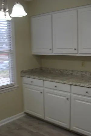 a view of cabinets and window