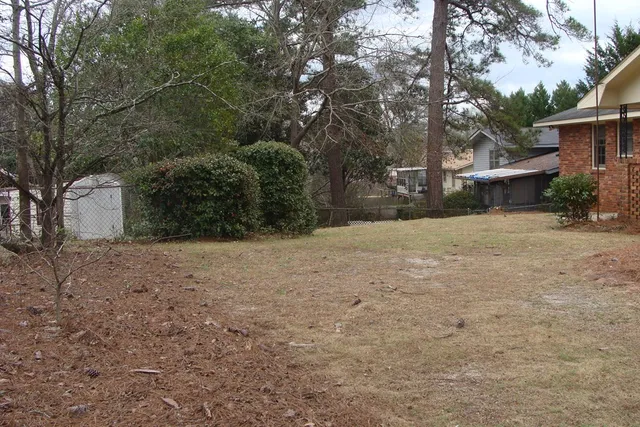 a view of a house with a snow in the yard