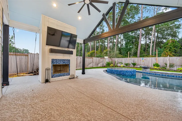 a view of a livingroom with furniture and a fireplace