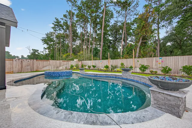 a view of a backyard with swimming pool