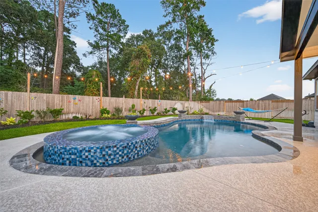 a view of a swimming pool with a sitting area
