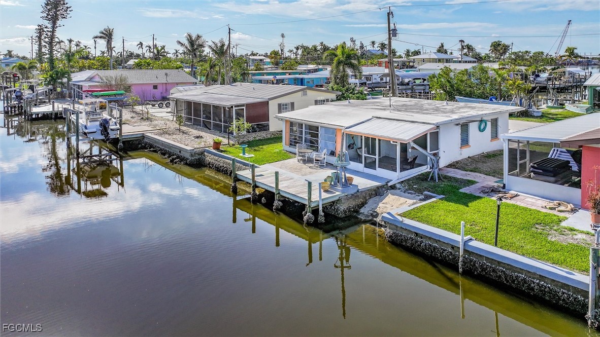 11494 May Street Matlacha, FL 33993 - Photo 26 of 45 a view of a patio with chairs