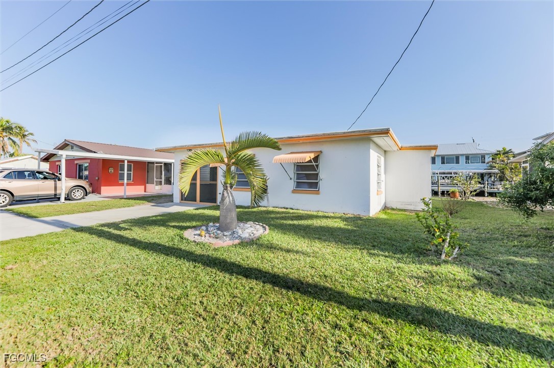11494 May Street Matlacha, FL 33993 - Photo 28 of 45 a house view with a garden space
