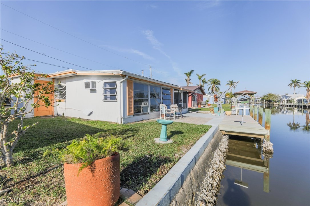 11494 May Street Matlacha, FL 33993 - Photo 32 of 45 a view of house with outdoor space and swimming pool