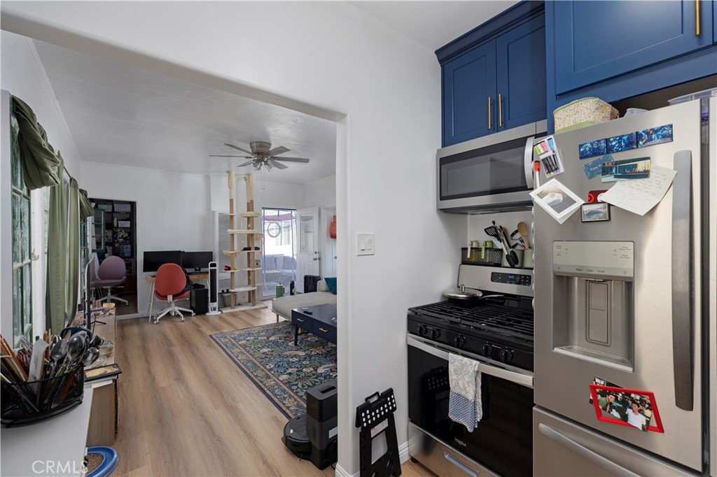 28 Argonne Avenue Long Beach, CA 90803 - Photo 8 of 20 a kitchen with stainless steel appliances granite countertop a stove and a refrigerator
