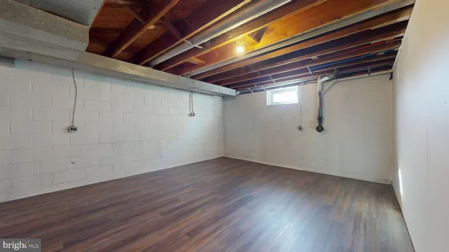 a view of room with wooden floor and window