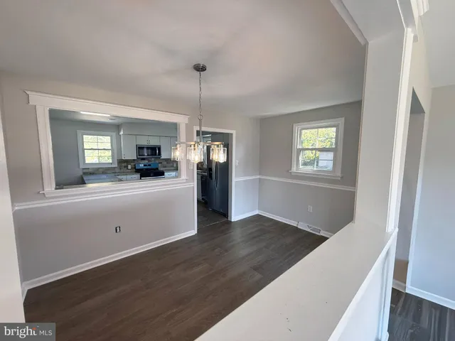 a view of a kitchen from the hallway
