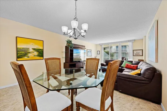 a view of a dining room with furniture a livingroom and wooden floor