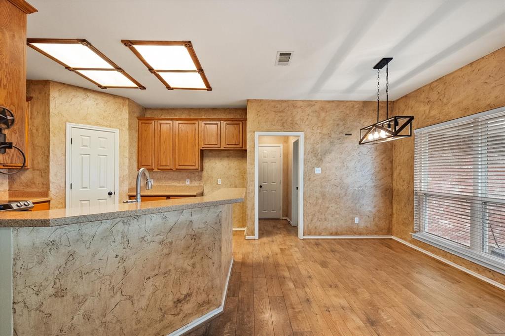 5250 Plainview Road Midlothian, TX 76065 - Photo 20 of 37 a bathroom with a granite countertop sink a mirror and shower