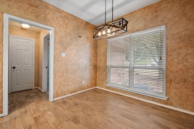 a view of a kitchen with a sink and a refrigerator