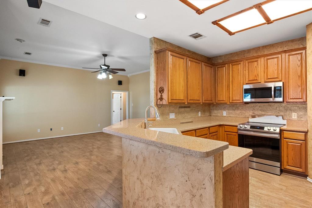 5250 Plainview Road Midlothian, TX 76065 - Photo 24 of 37 a kitchen that has a sink and a stove top oven