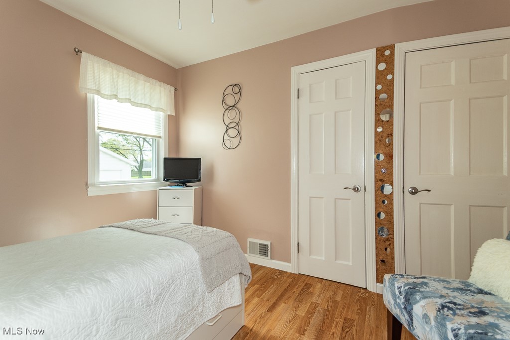 1237 Mayfield Ridge Road Cleveland, OH 44124 - Photo 29 of 38 Bedroom featuring light wood finished floors and a ceiling fan