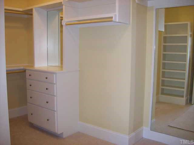 5323 Landguard Drive Raleigh, NC 27613 - Photo 8 of 8 The master closet and all guest closets feature custom millwork, full length built in mirrors and drawers Other