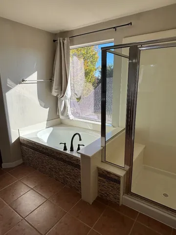 a bathroom with a sink and a large mirror
