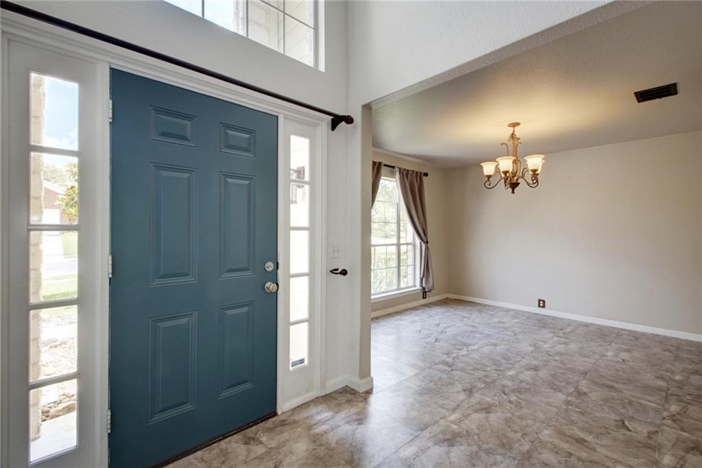714 Adler Falls Lane Round Rock, TX 78665 - Photo 3 of 18 wooden floor in an empty room with a window