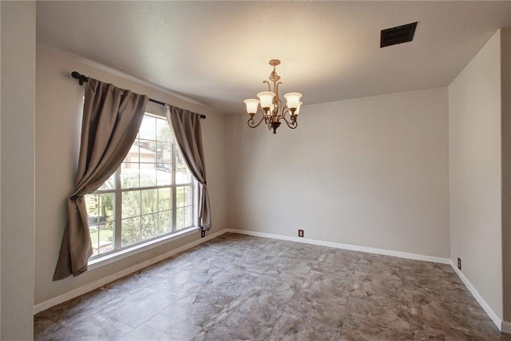 714 Adler Falls Lane Round Rock, TX 78665 - Photo 4 of 18 wooden floor in an empty room with a window