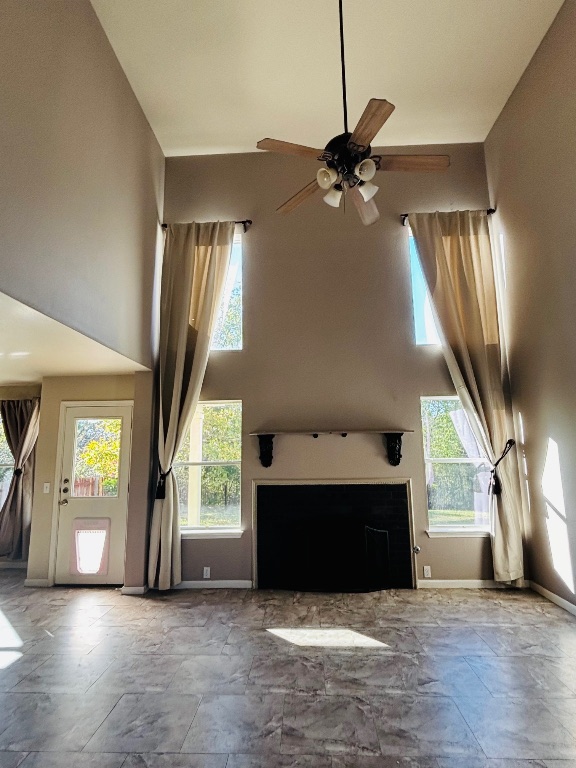 714 Adler Falls Lane Round Rock, TX 78665 - Photo 7 of 18 a view of an empty room with a fireplace and a window
