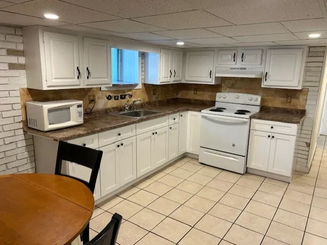 a kitchen with stainless steel appliances granite countertop a sink and cabinets