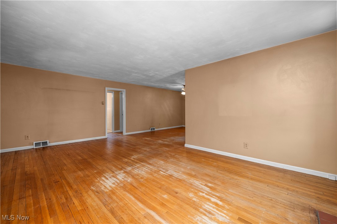 25950 Bagley Road Olmsted Falls, OH 44138 - Photo 9 of 32 Empty room with light wood-type flooring and a ceiling fan