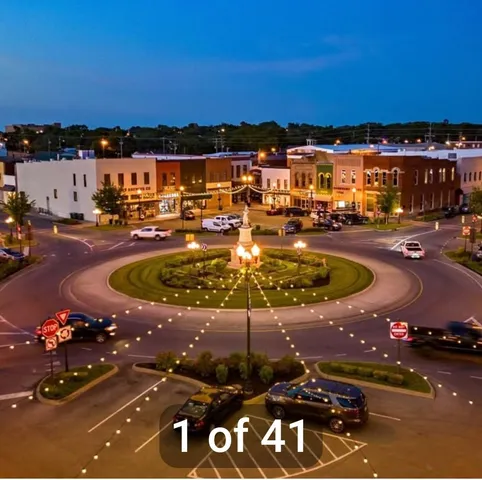 a view of a swimming pool with a table and chairs