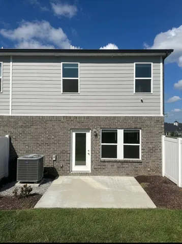 a front view of a house with yard