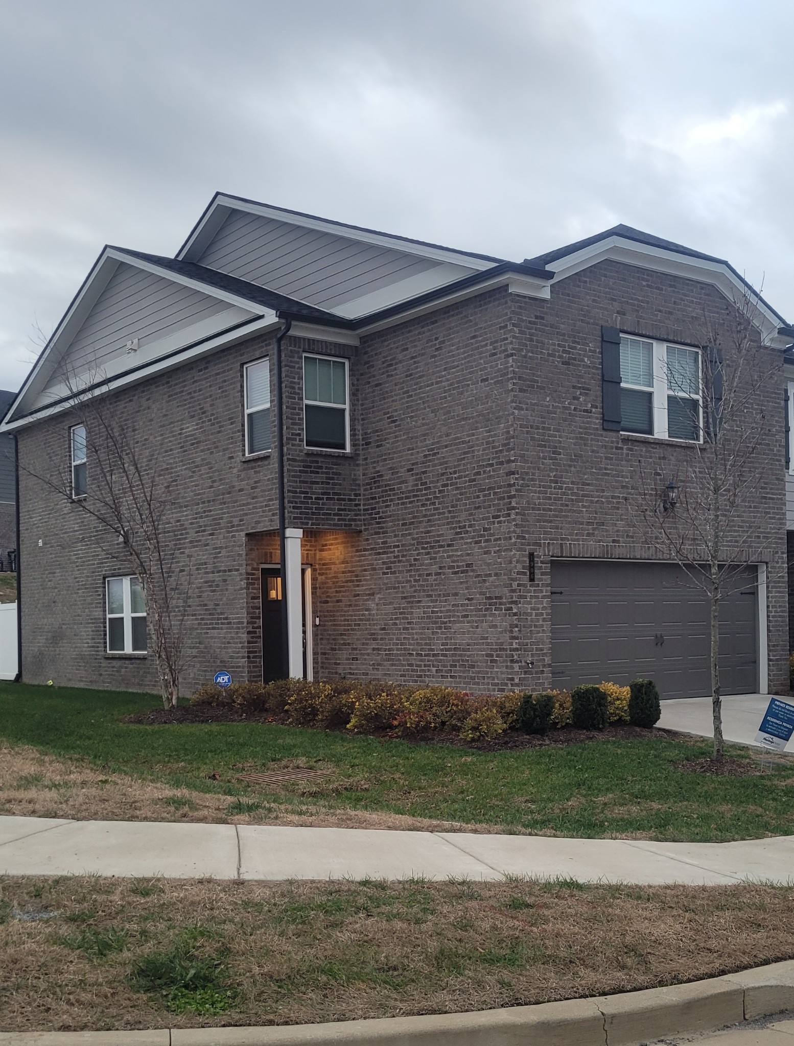 1906 Cascade Court Lebanon, TN 37087 - Photo 2 of 18 a front view of a house with a garden