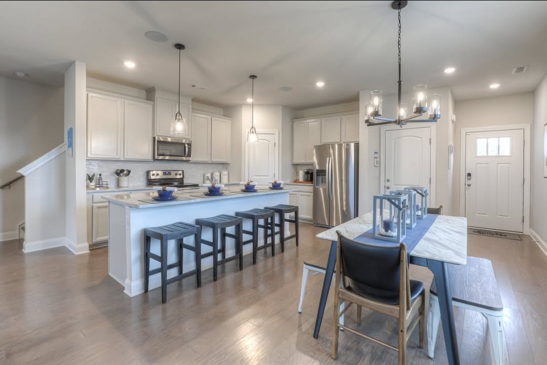 1906 Cascade Court Lebanon, TN 37087 - Photo 5 of 18 a view of a dining room with furniture a chandelier and wooden floor