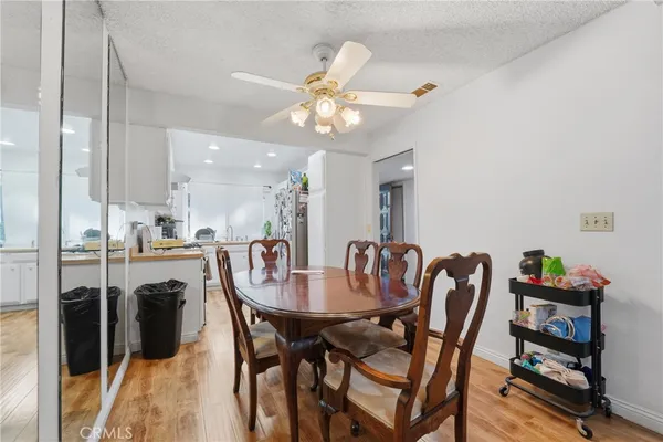 a dining room with furniture and window