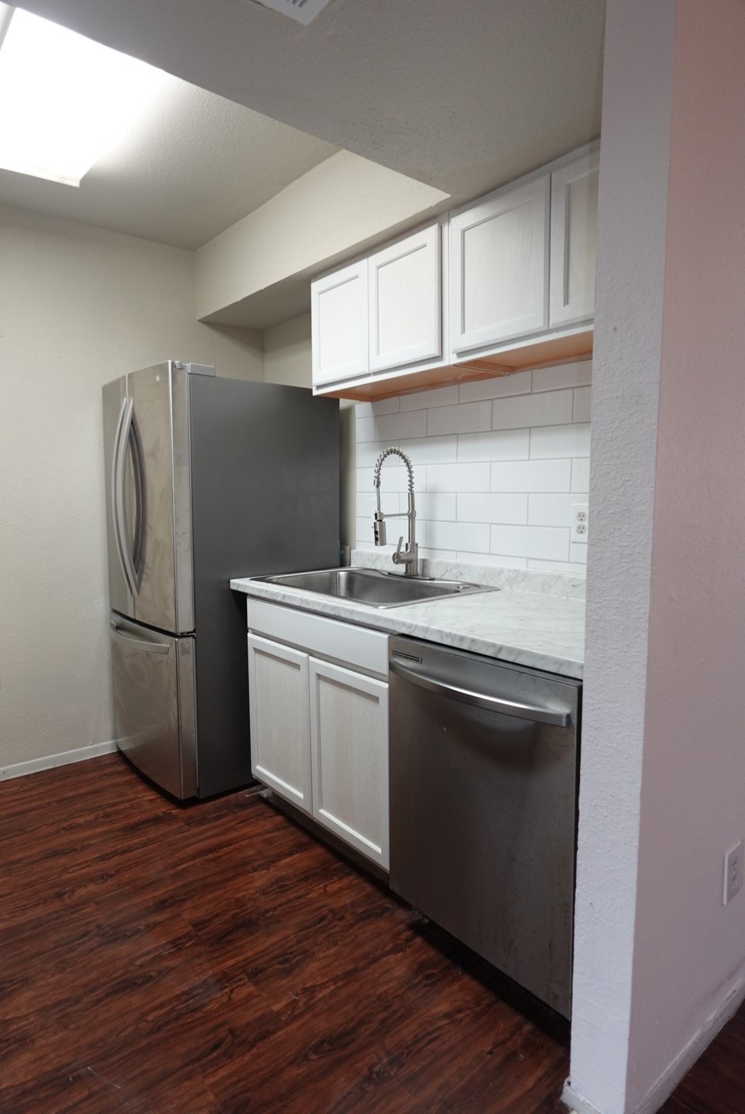 6001 Reims Road, Unit 1207 Houston, TX 77036 - Photo 15 of 36 a kitchen with stainless steel appliances granite countertop a refrigerator sink and cabinets