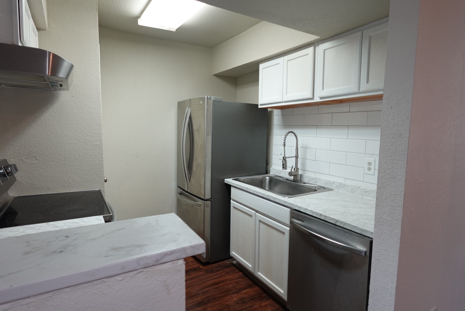 6001 Reims Road, Unit 1207 Houston, TX 77036 - Photo 17 of 36 a kitchen with a sink cabinets and stainless steel appliances