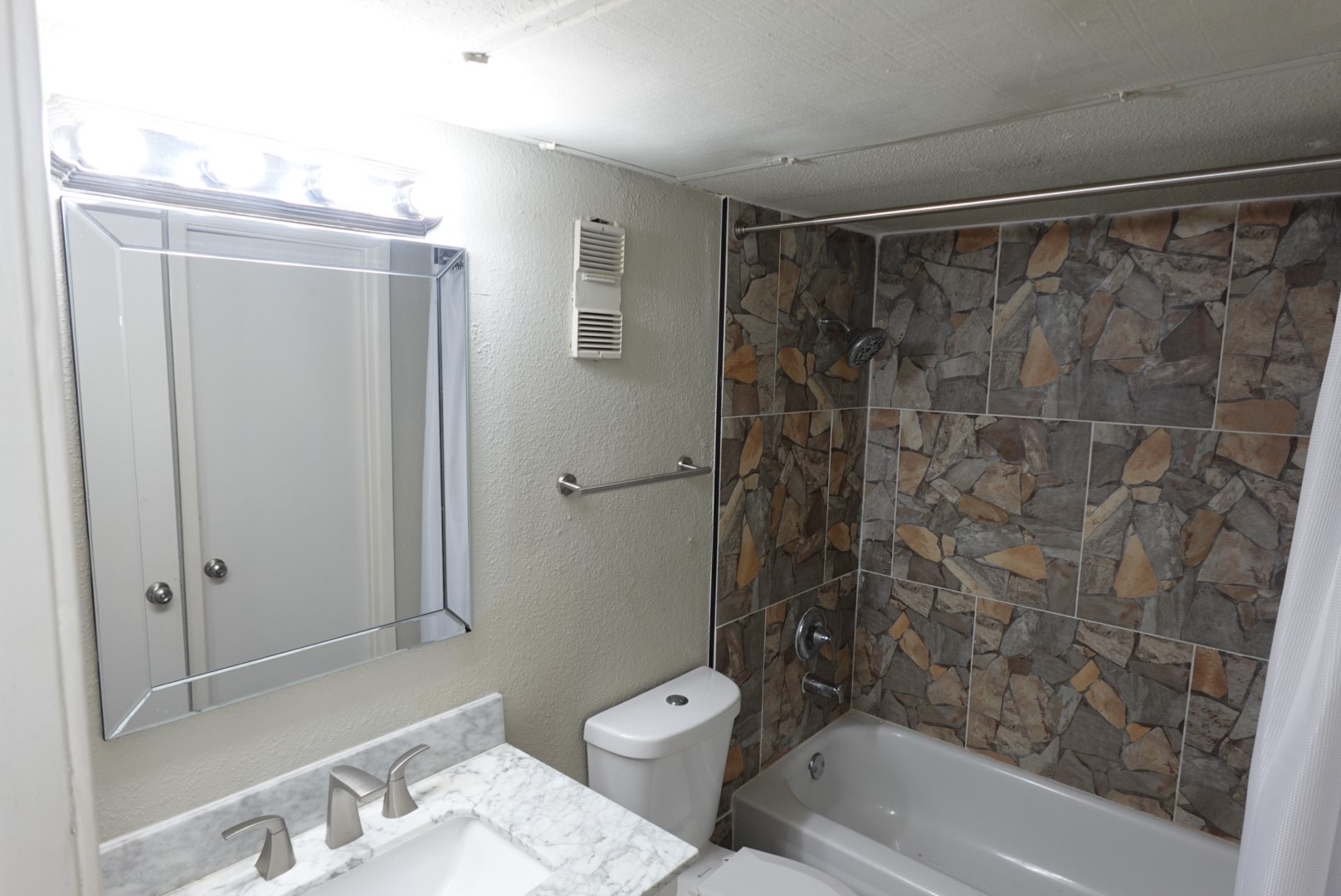 6001 Reims Road, Unit 1207 Houston, TX 77036 - Photo 24 of 36 a bathroom with a shower and a toilet