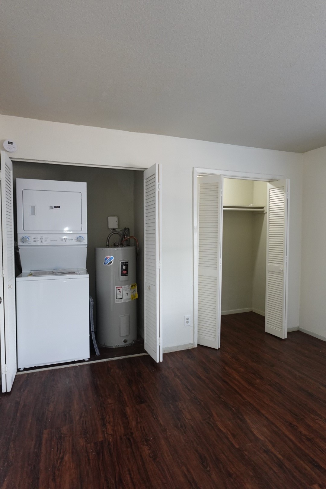 6001 Reims Road, Unit 1207 Houston, TX 77036 - Photo 28 of 36 wooden floor in an empty room and a bathroom