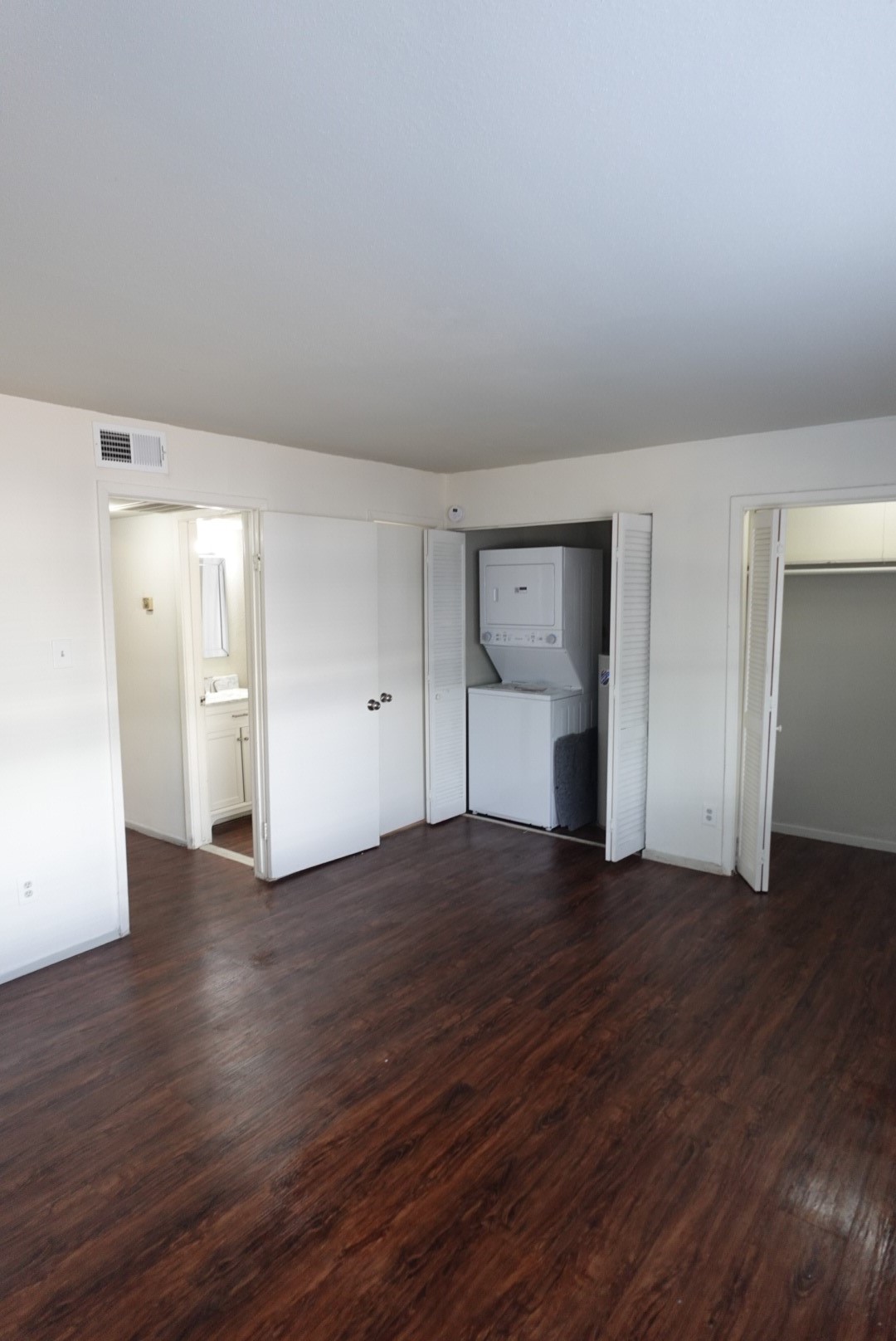 6001 Reims Road, Unit 1207 Houston, TX 77036 - Photo 34 of 36 a view of empty room with wooden floor