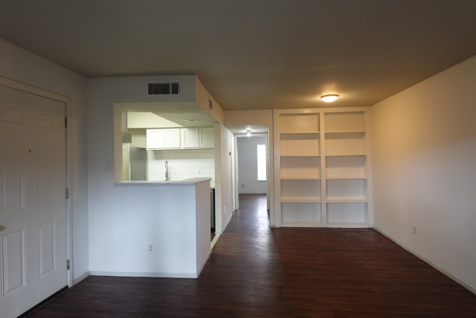 6001 Reims Road, Unit 1207 Houston, TX 77036 - Photo 4 of 36 a view of a room with wooden floor and a window