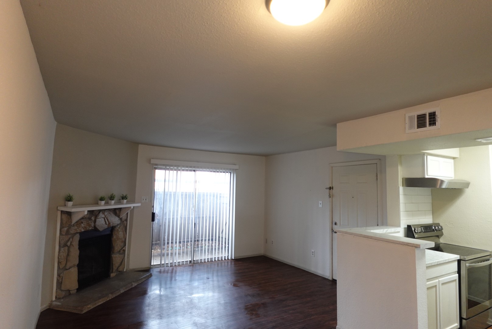 6001 Reims Road, Unit 1207 Houston, TX 77036 - Photo 7 of 36 a kitchen with a stove a washer and dryer