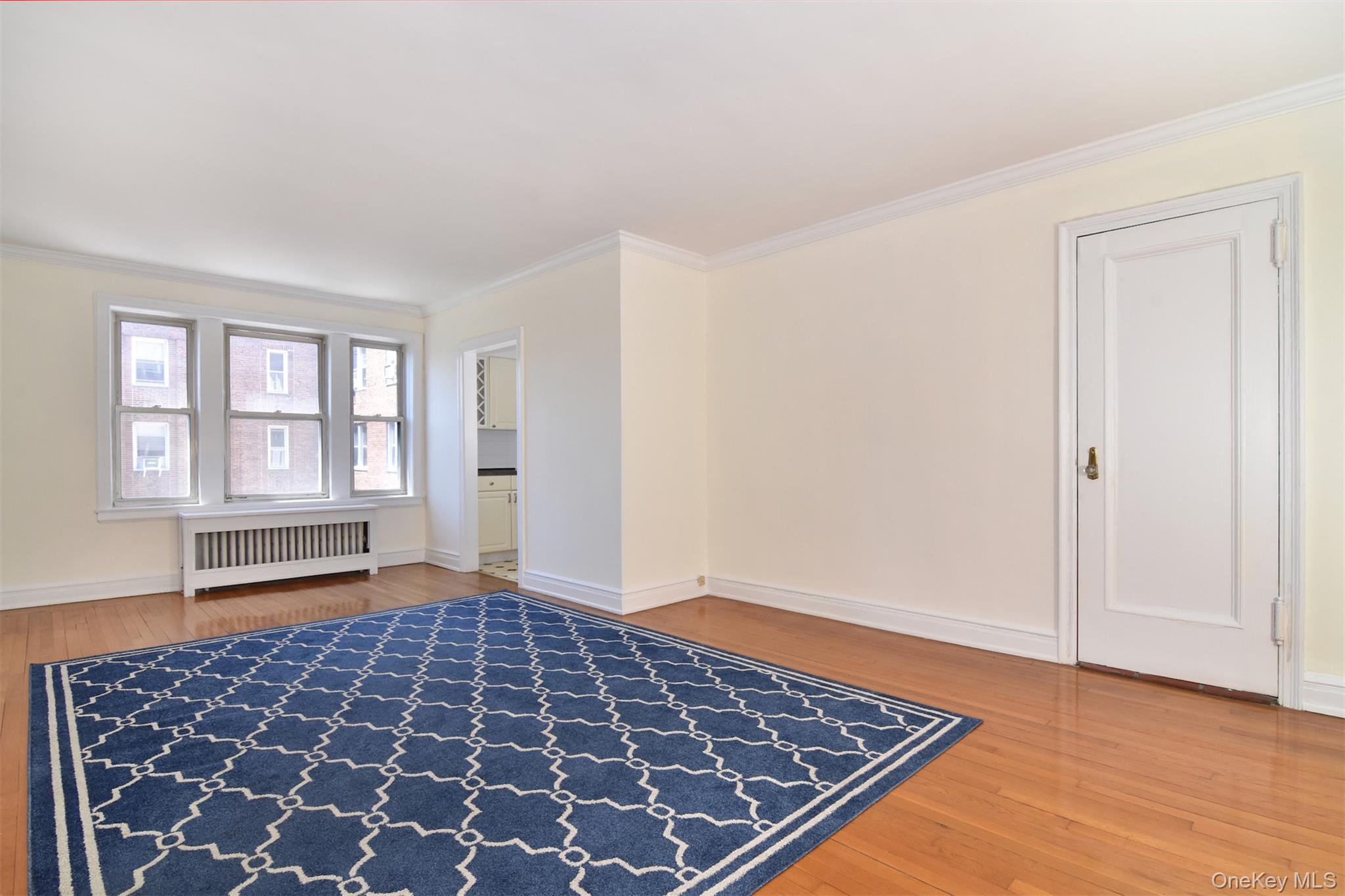 280 Bronxville Road, Unit 5W Bronxville, NY 10708 - Photo 4 of 14 Original hardwood floors add warmth and character, while large windows fill the space with natural light. Custom radiator covers provide an attractive finishing touch throughout.